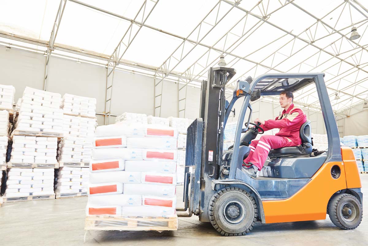 Warehousing.,forklift,driver,stacking,pallets,with,cement,packs,by,stacker