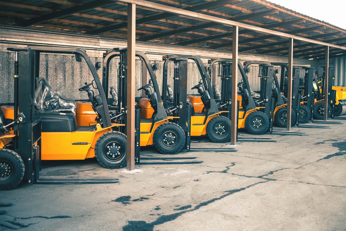 Background,of,a,lot,of,forklifts,,reliable,heavy,loader,,truck.